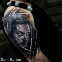 Mystical illustrative style shoulder tattoo of demonic man with cross