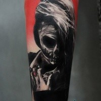 Mystical looking colored forearm tattoo of mystical woman stylized by skeleton