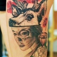 Mystical looking colored thigh tattoo of woman with deer and flowers