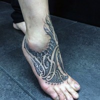 Mystical painted black and white ornament tattoo on foot