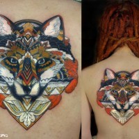 Mystical painted colored fox stylized with ornaments tattoo on back