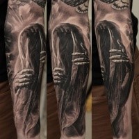 Mystical realism style forearm tattoo of mystical ghost