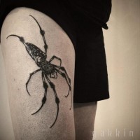 Natural looking 3D big black and white spider tattoo on thigh