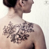 Natural looking 3D like flowers with bird tattoo on shoulder