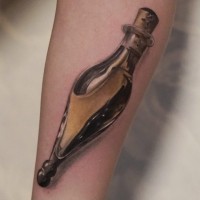 Natural looking 3D like forearm tattoo of magical bottle