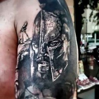 Natural looking black and white shoulder tattoo of Spartan king portrait