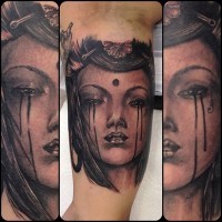 Natural looking black ink arm tattoo of Asian woman portrait