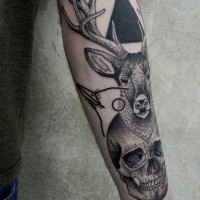 Natural looking black ink deer tattoo on forearm with human skull and black triangle