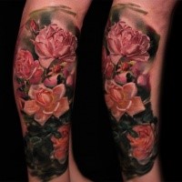 Natural looking colored arm tattoo of beautiful roses