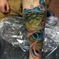 Natural looking colored big hooked fish tattoo on arm
