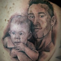 Natural looking colored big shoulder tattoo of family portrait