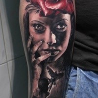 Natural looking colored forearm tattoo of woman face with rose and pigeon