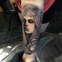 Natural looking colored leg tattoo of woman with vine and jewelry