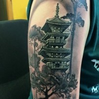 Natural looking colored shoulder tattoo of night Asian house with big trees