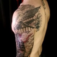 Natural looking colored shoulder tattoo of samurai warrior and old house