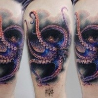 Natural looking colored thigh tattoo of octopus