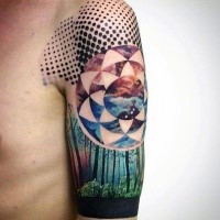 Natural looking colored upper arm tattoo of forest combined with floral ornament