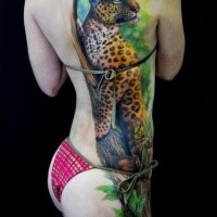 Natural looking colored whole back and thigh tattoo of leopard with butterflies