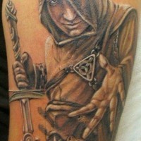 Natural looking detailed shoulder tattoo of antic assassin with great sword