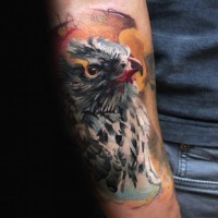 Natural looking multicolored forearm tattoo of beautiful eagle
