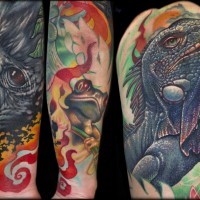 Natural looking multicolored forearm tattoo of various animals