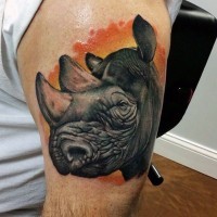 Natural looking multicolored shoulder tattoo of big rhino head