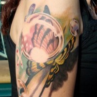 Natural looking multicolored shoulder tattoo of butterfly and water bulbs