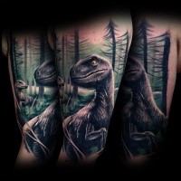 Natural looking shoulder tattoo of dinosaur in forest
