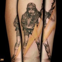 Natural looking very detailed AC/DC guitarist tattoo on forearm with lightning