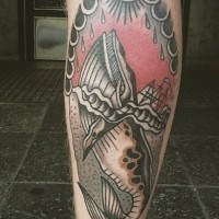 Nautical style black and white big wale with ship tattoo on leg