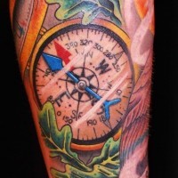 Nautical style great detailed and colored big compass tattoo on leg