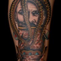Nautical style multicolored octopus with man and fish tattoo on arm
