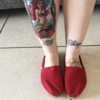 Nautical style painted Ariel cartoon mermaid portrait tattoo on leg with lettering