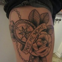 Nautical style simple black ink compass with lettering and flowers tattoo on thigh