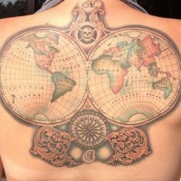 Nautical themed colorful globes tattoo on back stylized with compass and skull