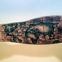 Nautical world map detailed tattoo with lettering on arm