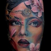 Neo japanese style colored beautiful geisha tattoo on arm with flowers