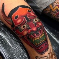 Neo japanese style colored demon mask tattoo on knee