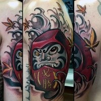 Neo japanese style colored shoulder tattoo of evil daruma doll with leaves