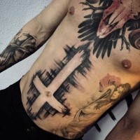 Neo traditional black ink cross tattoo on belly