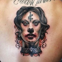 Neo traditional colored back tattoo of zombie woman with cross