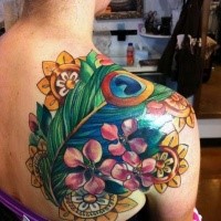 Neo traditional colored shoulder tattoo of peacock feather with flowers