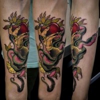 Neo traditional snake with apple tattoo on forearm