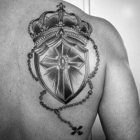 Neo traditional style black and white crown with shield tattoo on back