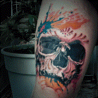 Neo traditional style colored arm tattoo of human skull with paint prints