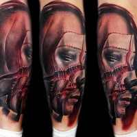 Neo traditional style colored arm tattoo of ripped mans face