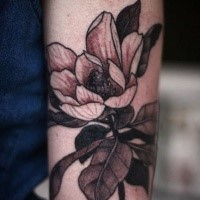 Neo traditional style colored arm tattoo of small flower
