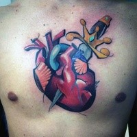 Neo traditional style colored chest tattoo of human heart with dagger