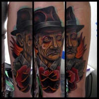 Neo traditional style colored forearm tattoo of old man with flowers