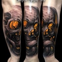 Neo traditional style colored forearm tattoo of creep demonic skull